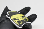 Side angle view showing 3D layered detail of yellow Toyota Supra Mk5 keychain by LayerPlay Pocket Motors