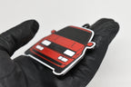 Side angle view showing 3D layered detail of red Volkswagen Corrado VR6 keychain by LayerPlay Pocket Motors