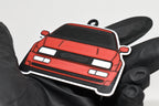 3D printed red Volkswagen Corrado VR6 keychain held in hand, front view detail by LayerPlay Pocket Motors