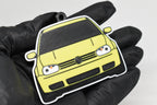 3D printed yellow Volkswagen MK4 GTI keychain held in hand, front view detail by LayerPlay Pocket Motors