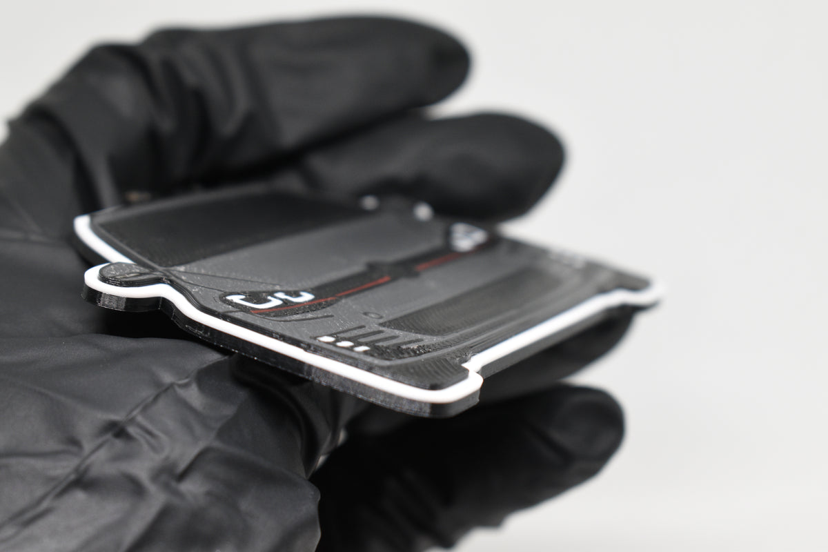 Side angle view showing 3D layered detail of space gray and black Volkswagen MK7 GTI keychain by LayerPlay Pocket Motors