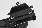 3D printed space gray and black Volkswagen MK7 GTI keychain held in hand, front view detail by LayerPlay Pocket Motors
