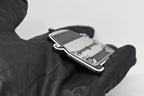 Side angle view showing 3D layered detail of light gray Volkswagen MK8 GTI keychain by LayerPlay Pocket Motors