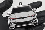 3D printed light gray Volkswagen MK8 GTI keychain held in hand, front view detail by LayerPlay Pocket Motors