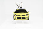 Yellow Neon SRT‑4 keychain displayed on a white stand with metal ring and clip.