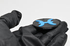 Side angle view showing raised 3D blue pisces sign detail and thickness on black disc keychain by LayerPlay